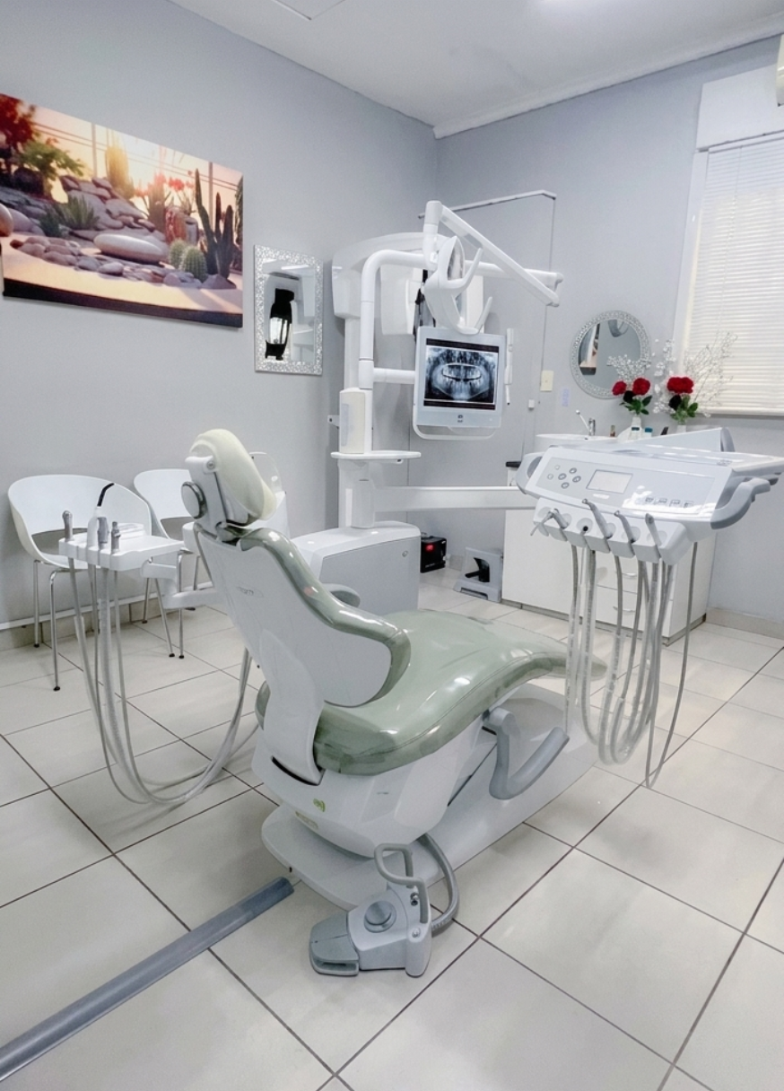 Modern dental treatment room with dental chair and X-ray equipment
